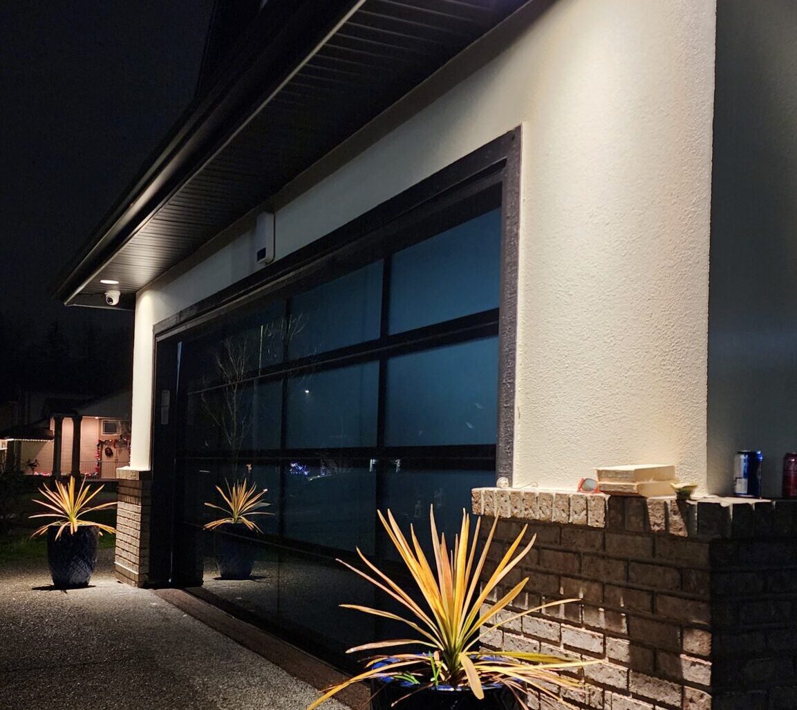 Modern glass full‑view garage door installation in Kerrisdale